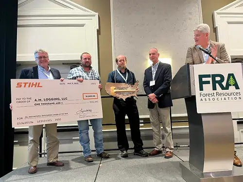 A.M. Logging being presented the 2023 National Outstanding Logger Award by FRA