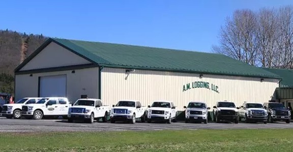 AM Logging Office with fleet of trucks